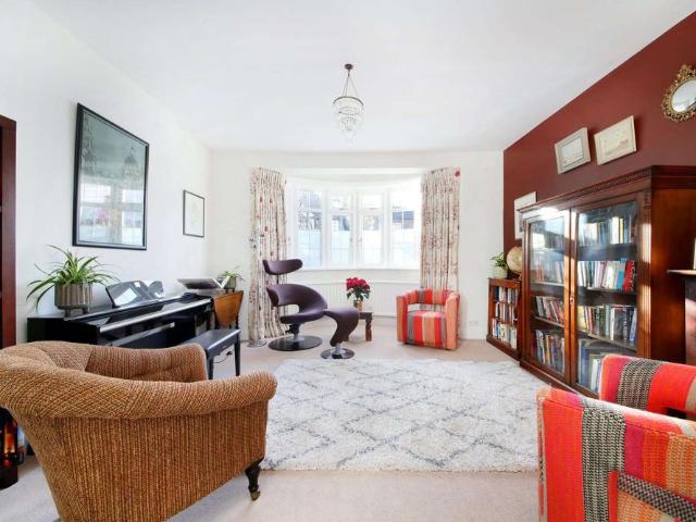 An impressive five bedroom detached home on one of East Sheen's highly regarded Parkside roads