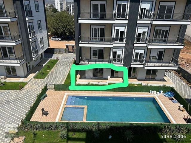 ANTALYA KEPEZ ŞELALE MAH.HAVUZLU SİTE İÇİNDE AYRI MUTFAKLI 2+1 SATILIK GİRİŞ KATI DAİRE