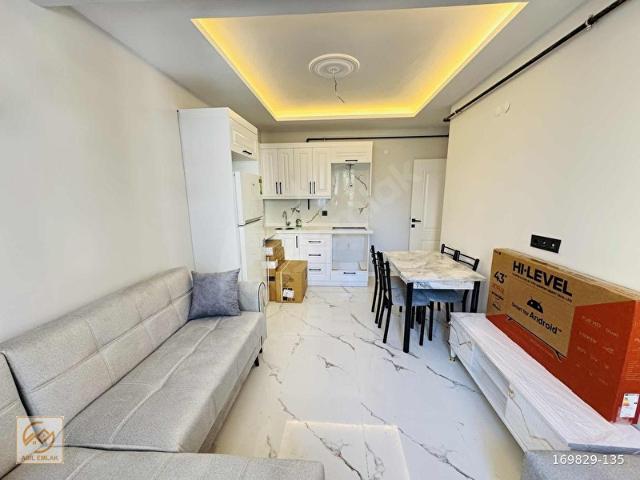 ASİL EMLAK'tan SİTE İÇERİSİNDE 1+1 EŞYALI ARA KAT SIFIR DAİRE