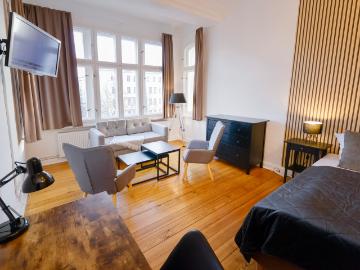 Apartment in traditional building with large living room and view across Greifswalder Strasse