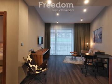 Apartament hotelowy z gwarancją najmu i tarasem 12 m2