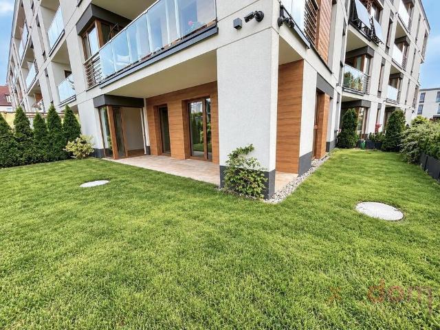 Apartament 72 m² z ogrodem, garażem i 2 komórkami