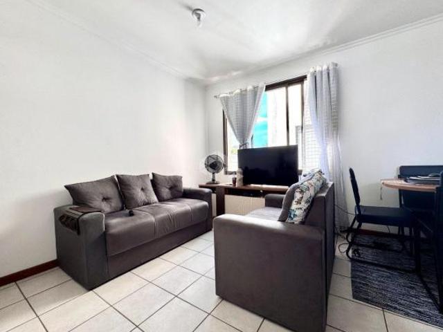 Apartamento um quarto, com lareira, churrasqueira e uma vaga