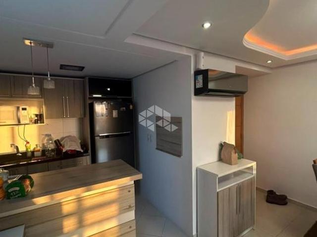Apartamento à venda em Guaíba, com 3 dormitórios, 2 banheiros, living aconchegan