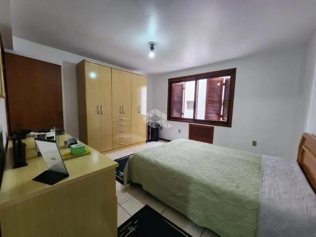 Apartamento central 3 dormitórios com 2 banheiros