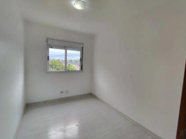 Apartamento de 2 dormitórios, living, cozinha planejada, área de serviço, banheiro social e 1 vaga d