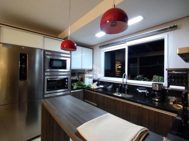 Apartamento localizado no bairro Monte Pasqual, com 107 m² com três dormitórios e uma suíte