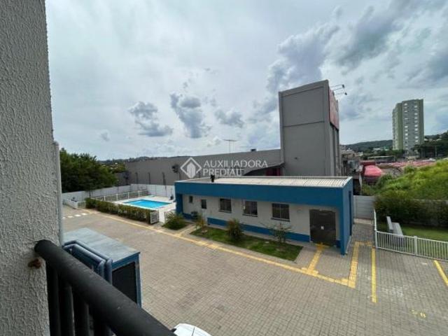 Apartamento no Operário/NH 2 dor. com sacada c/churr.,garagem, cond.com piscina,s.festas, elevador