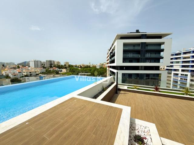 Apartamento nuevo de 2 dormitorios con piscina cerca de la playa en Portimão