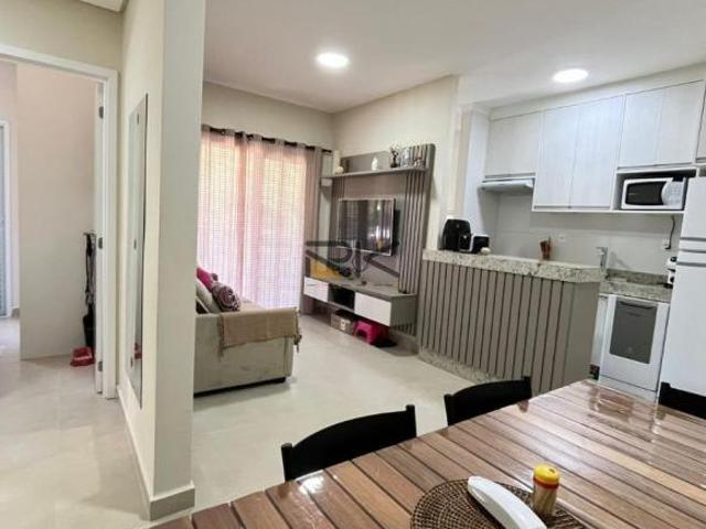 APARTAMENTO PRAIA GRANDE com 2 dormitórios sendo 1 suíte,1 vaga de garagem,varanda gourmet com churr