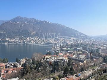 APPARTAMENTO NUOVO IN VILLA CON AMPI TERRAZZI E MAGNIFICA VISTA LAGO E CITTA'