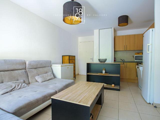 Appartement T2 en rez de jardin, parking double et cave