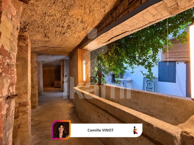 Appartement au cœur de Montmeyran avec balcon, cour, garage, caves, et surfaces supplémentaires