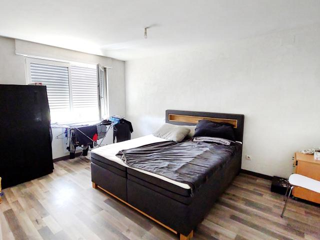 Appartement F3 en rez de chaussée de 58,91m2 hab. avec garage et parking