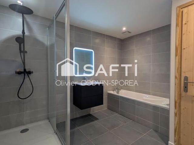 Appartement familiale en rez de chaussée de 60 m2 avec 2 chambres et un bureau et une place de parking extérieur