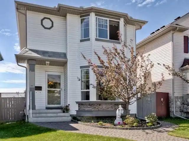 Arbour Lake house with walkout basement and beautiful yards