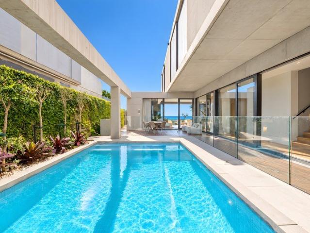 Architectural Masterpiece with an Expansive 15m* of Absolute Beach Frontage on a Large 607sqm* Block