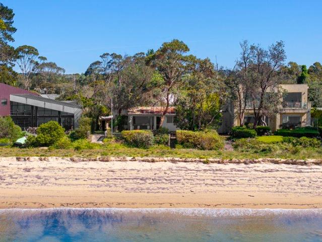 Absolute Beachfront Opportunity Rarely Offered Only Steps to the Water