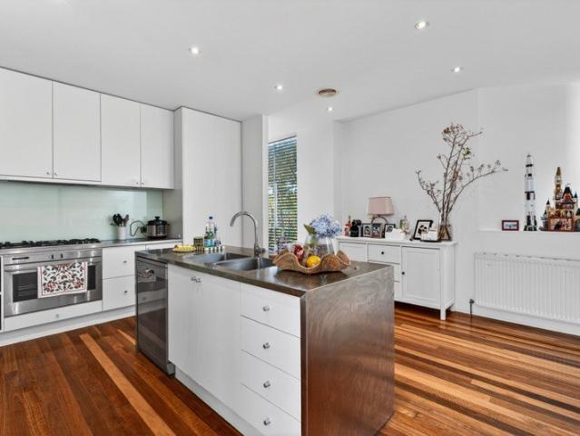 Architectural Brilliance with Rooftop Views in Prime Toorak Locale