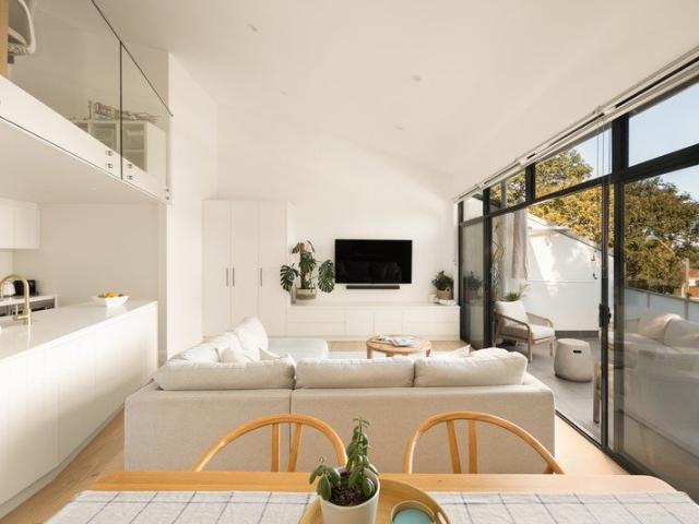 Architectural Coastal Apartment with Soaring Ceilings, Oversized Terrace and Mezzanine Retreat