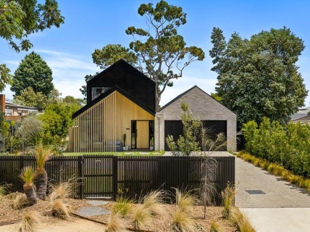 ARCHITECTURAL COASTAL LIVING IN A COVETED VILLAGE SETTING