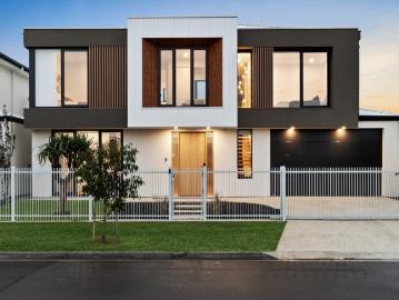 Architectural Coastal Luxury with Lift, Dual Master Suites & Effortless Indoor Outdoor Living