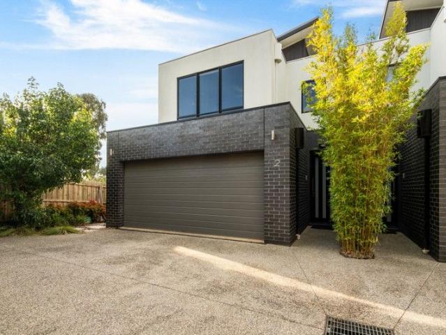 Architectural Excellence with Bay Views & Walk to Town Convenience
