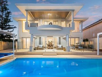 Architectural elegance meets absolute waterfront luxury