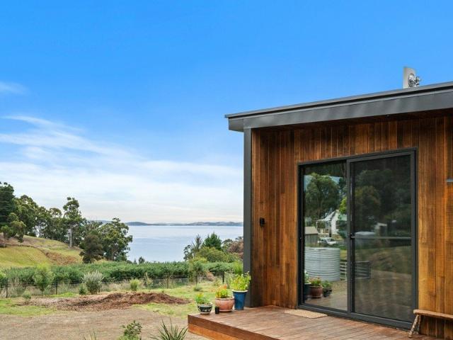 Architectural escape with income potential and water views