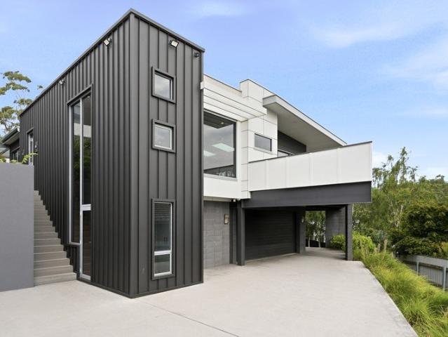 Architectural family home, stunning views, multiple living rooms and just moments to Punchbowl Reserve