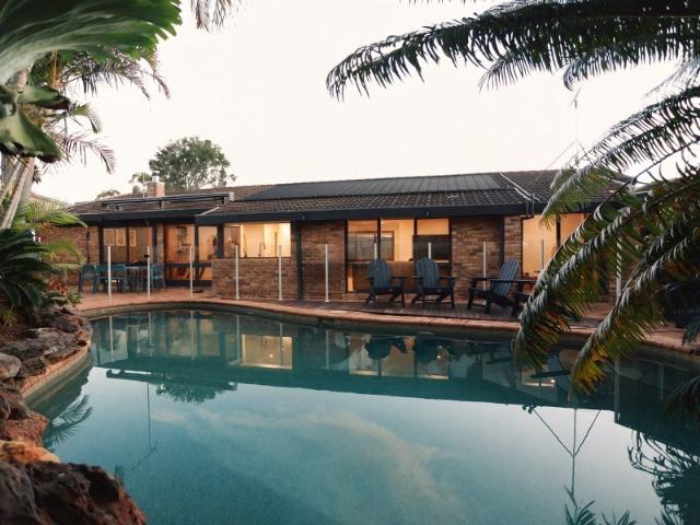 Architectural gem with lush gardens and inviting poolside retreat in quiet cul de sac street