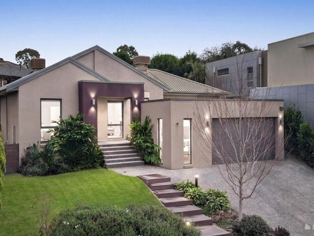 Architectural grandeur with poolside family living