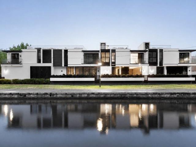 Architectural luxury with waterfront poise and a spectacular rooftop terrace
