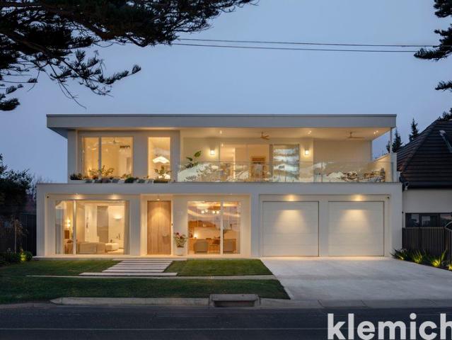 Architectural scale, refined interiors and exceptional amenity combine in this impressive coastal residence