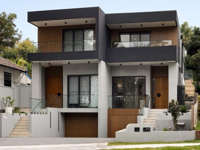 Architecturally crafted tri level home enjoys an elevated position