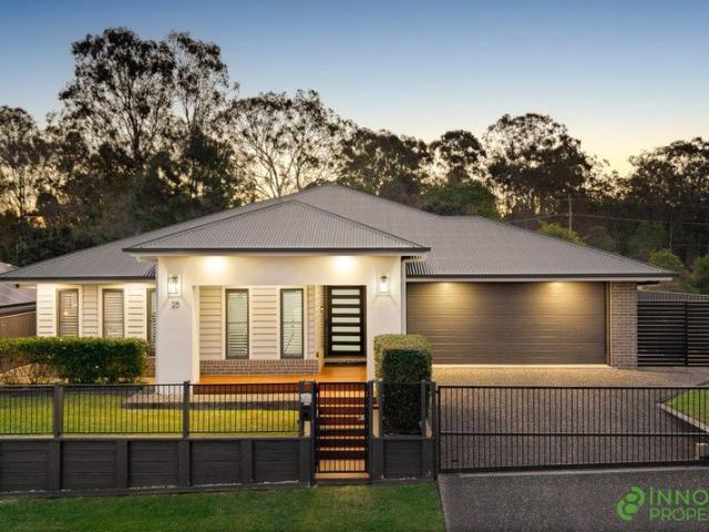 Architecturally Designed Family Entertainer with a Resort Style Pool, Premium Finishes & Unrivalled Privacy in a Prestigious Joyner Pocket!