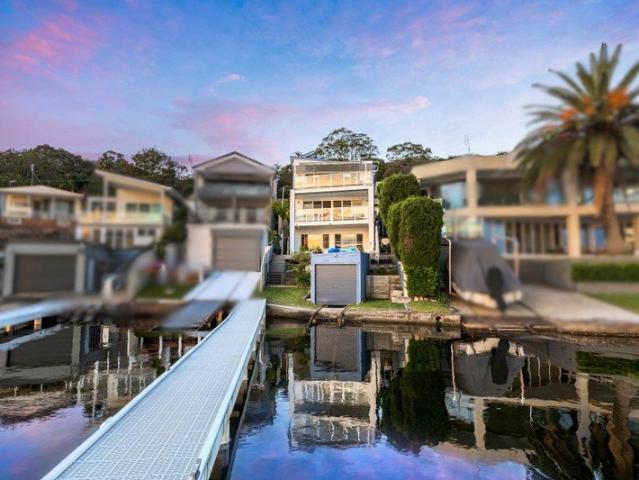Architecturally Designed Waterfront Living At Its Best