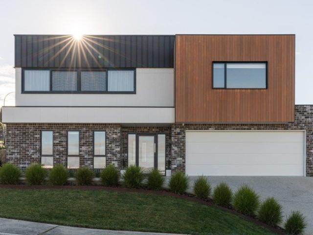 Architecturally designed, uninterrupted mountain views, flexible family living and an oversized garage