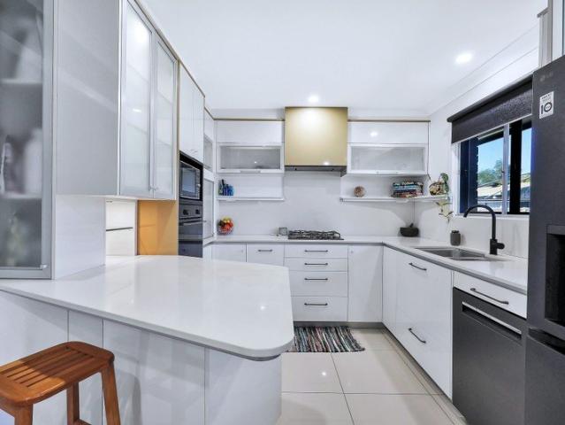 Architecturally Striking Moody Sophistication Meets Light Filled Living