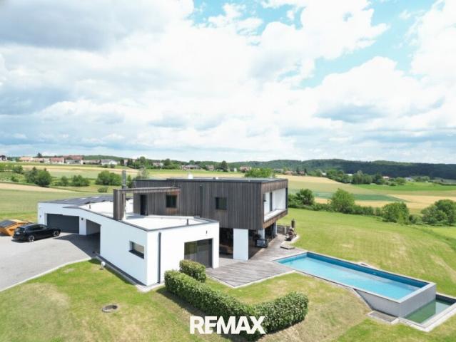 Ein Leben mit Weitblick – exklusives Architektenhaus mit Infinity Pool und einzigartigem Burgpanorama