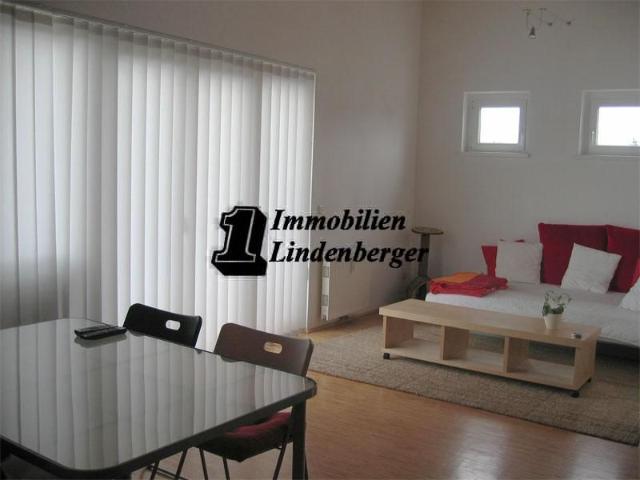 Architektonisch moderne 2 Zimmerwohnung mit südseitiger Terrasse und Garten, sowie PKW Stellplatz