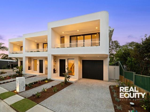 Curved Facade, Sandstone Entry, Balcony Garden and Three Living Areas: Brand New Torrens Title Residence in Moorebank