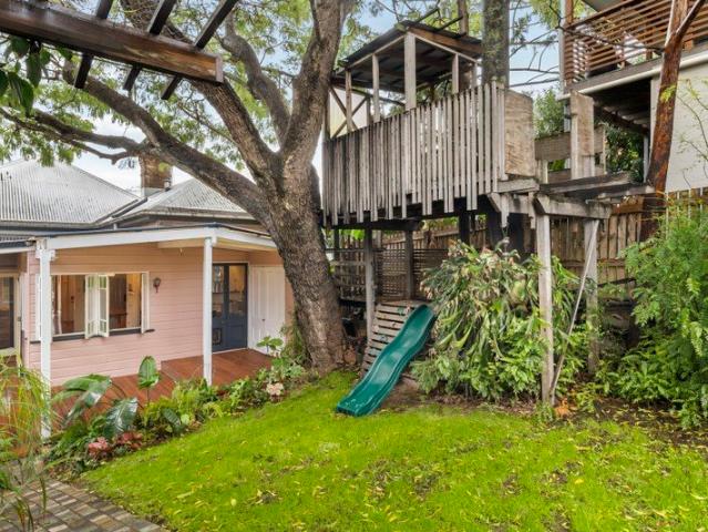 At the heart of the home is Queenslander Charm with Rare Dual Street Frontage & Future Potential