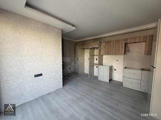 ATEŞBEY GAYRIMENKUL'DEN İNCEK'TE ARA KATTA, ŞIK MİMARİLİ 2+1