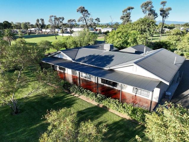 Attractive Family Home On Private Acreage