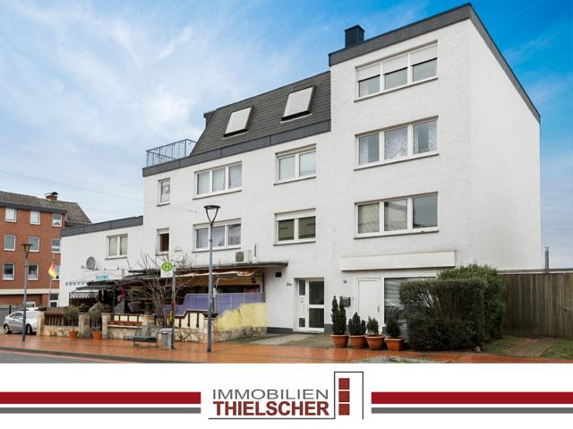 Attraktive Eigentumswohnung mit Dachterrasse und Garage in gepflegtem Wohn und Geschäftshaus