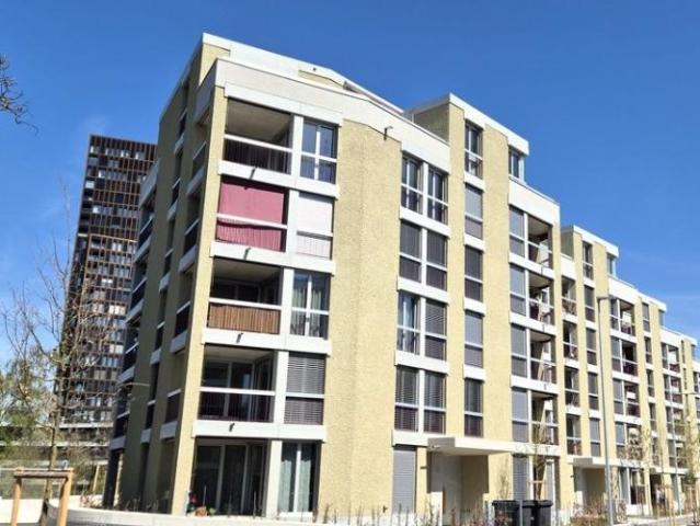 Attraktive und charmante Neubauwohnung mit Sitzplatz an bester Lage