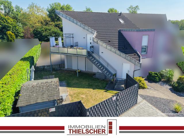 Attraktive 3 Zimmer Eigentumswohnung mit Balkon, Garten und zwei Stellplätzen