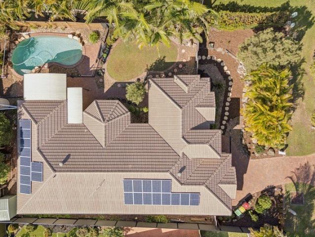 AUCTION IF NOT SOLD PRIOR Move In Ready Family Living with Multiple Living Areas and Poolside Entertaining