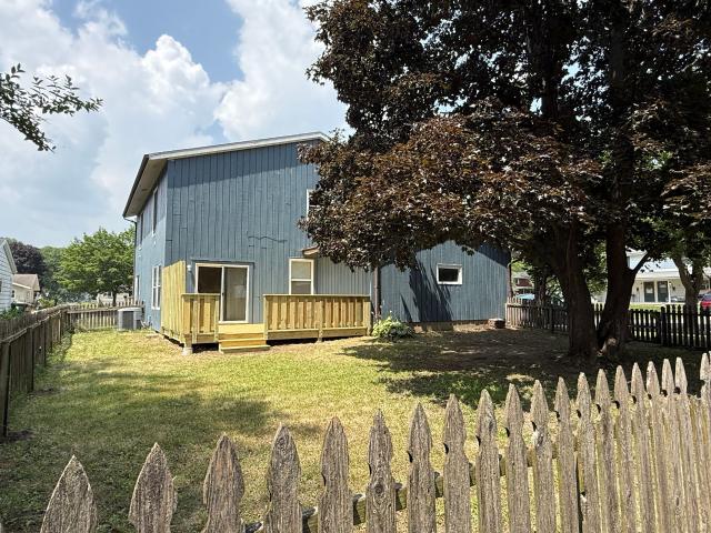 Call for rent special! New deck! 3 Bedroom, updated kitchen, updated flooring, garage, driveway, and fenced yard 9 month lease available!